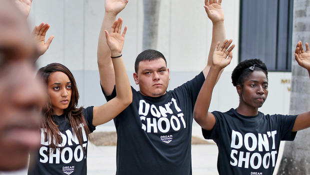 3034486-poster-p-1-hands-up-dont-shoot.jpg